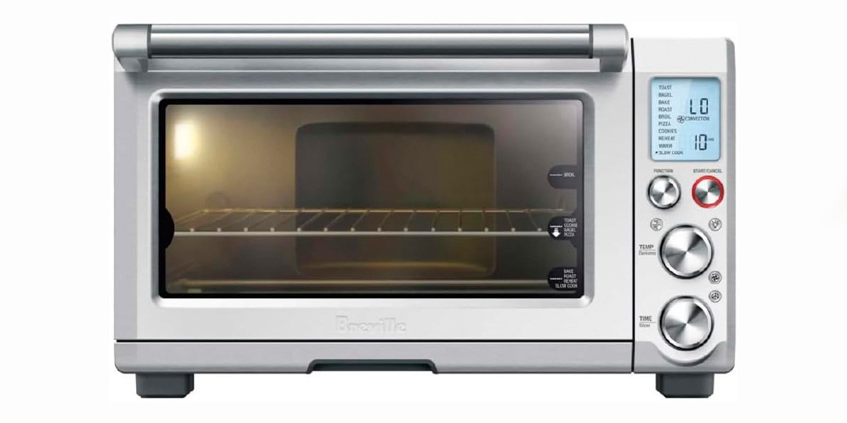 Image of Breville Smart Oven Pro with control panel lit up and inside light on