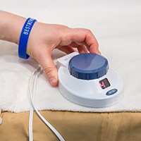 Person using electric blanket controller