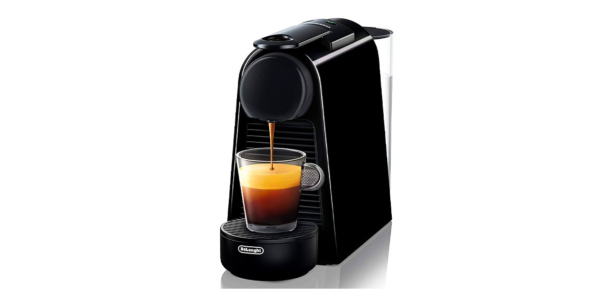 Nespresso Essenza Mini with cup of espresso on white background