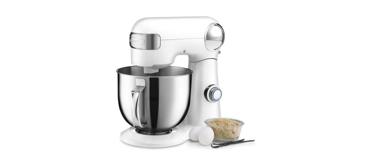 a white stand mixer with some eggs, brown sugar, and vanilla beans